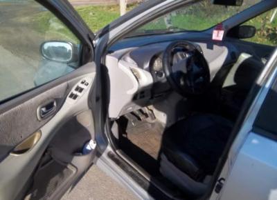 Фото Nissan Almera Tino